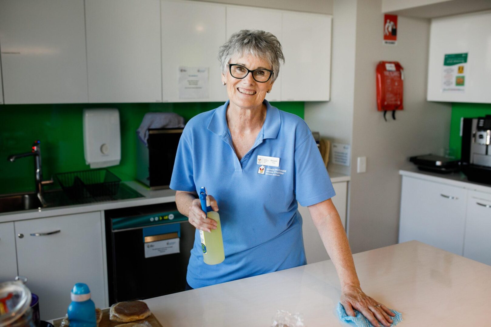 Photo of a volunteer in the kitchen at Ronald McDonald House Perth Children's Hospital