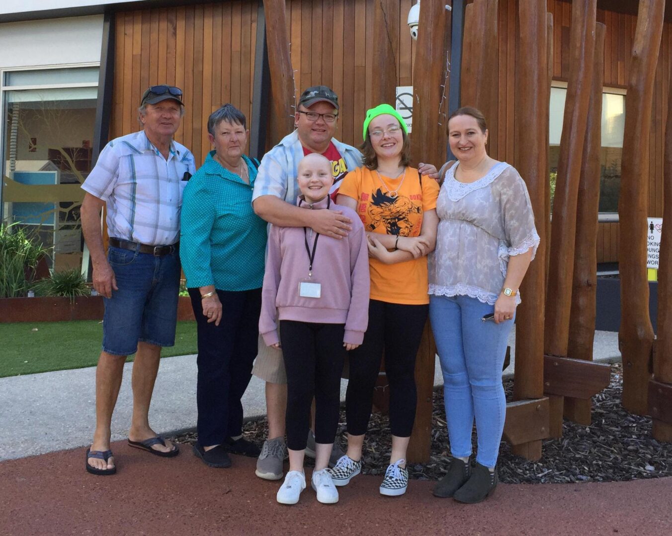 Photo of the Pusey family in front of Ronald McDonald House Nedlands