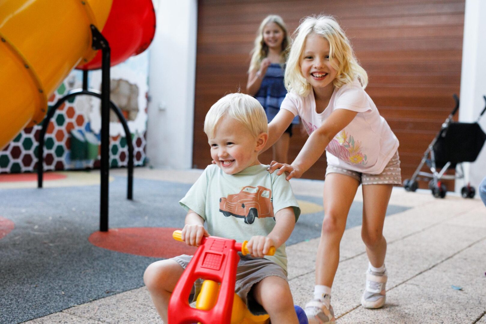 Children playing in the outdoor play area at Ronald McDonald House Nedlands